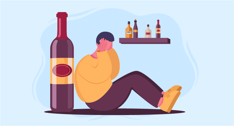 a man sitting next to a huge alcohol bottle highlighting Alcohol Withdrawal management