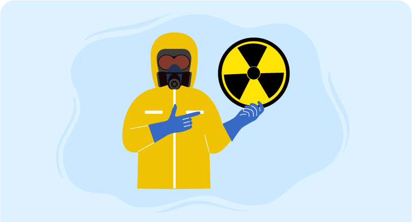 a person wearing yellow coat with face shield indicating decontamination and hazmat radiation